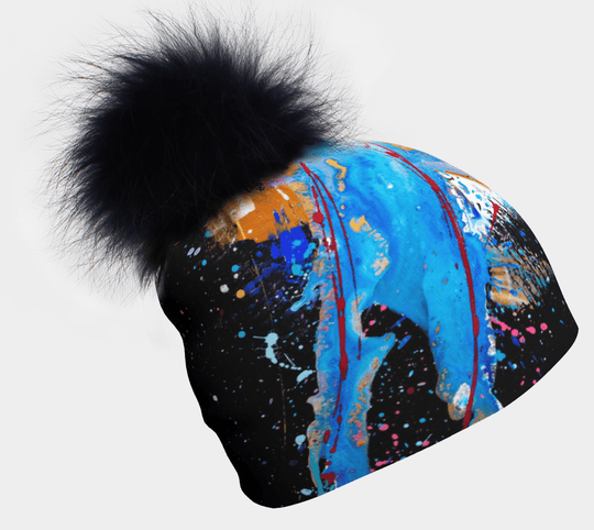 Tuque MatriX avec pompon noir, présentant des éclaboussures de peinture abstraites vibrantes bleues, rouges et dorées sur fond noir.