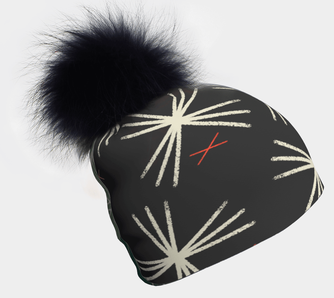 Tuque MotifX noire avec un gros pompon noir et un motif graphique blanc.