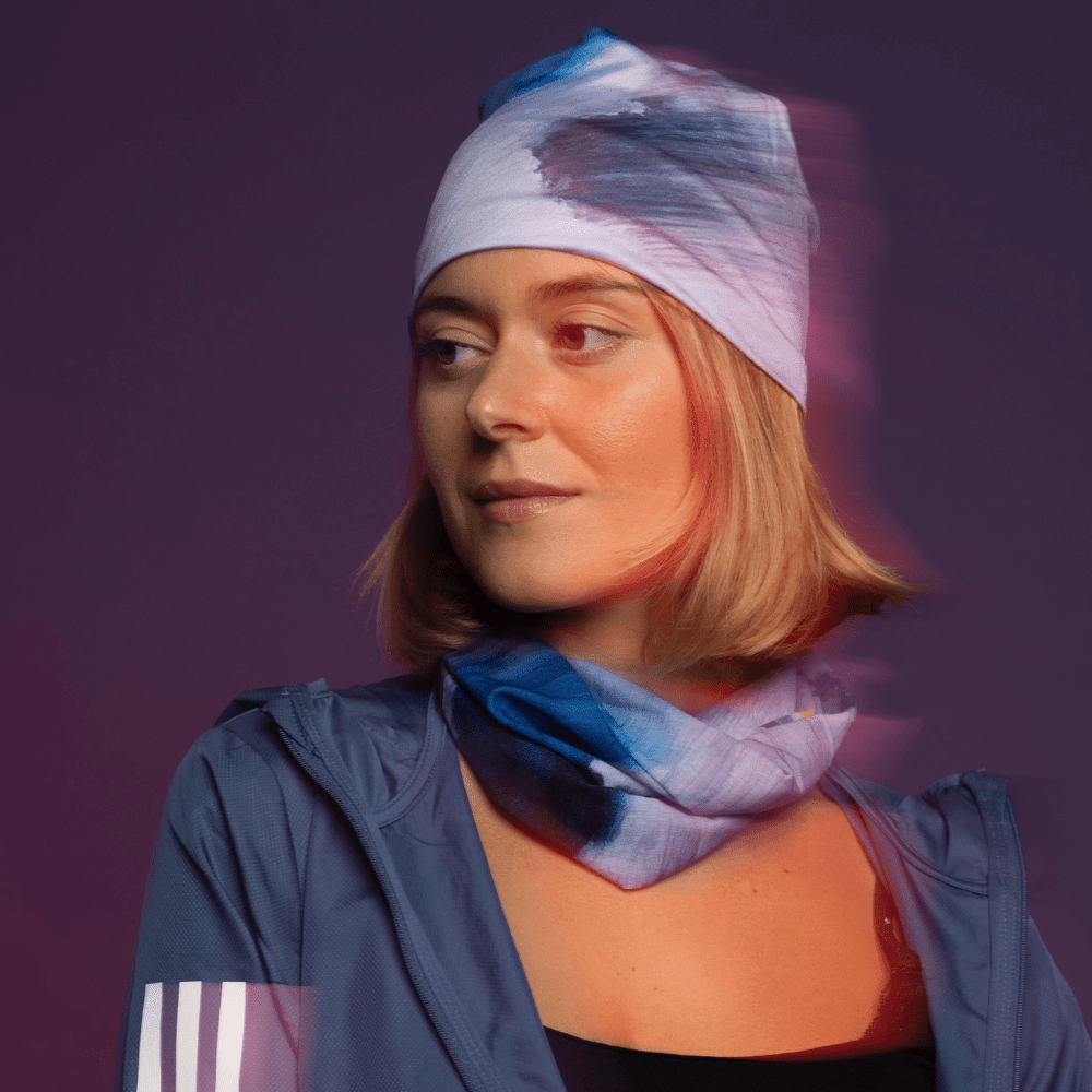 A woman wearing a blue jacket and a &