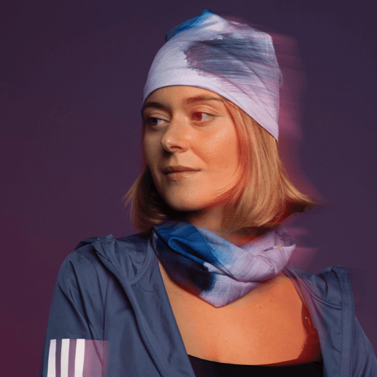 A woman wearing a blue jacket and a &