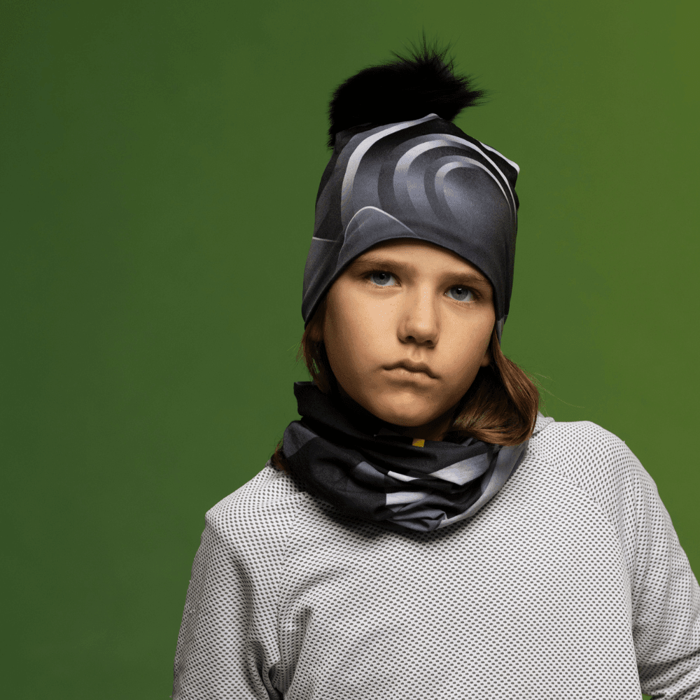 Close-up of a child wearing the Rockies Beanie and neck gaiter, showcasing the design.