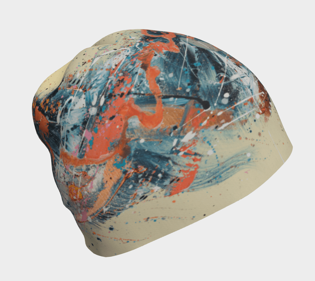 Close-up of the Sphénédon Beanie showcasing abstract teal, orange, and cream paint splatters.