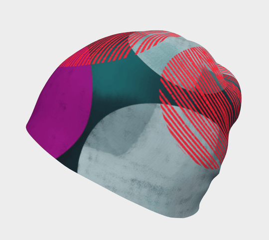 Gros plan de la tuque Pois Bleu-Vert montrant son motif artistique unique.