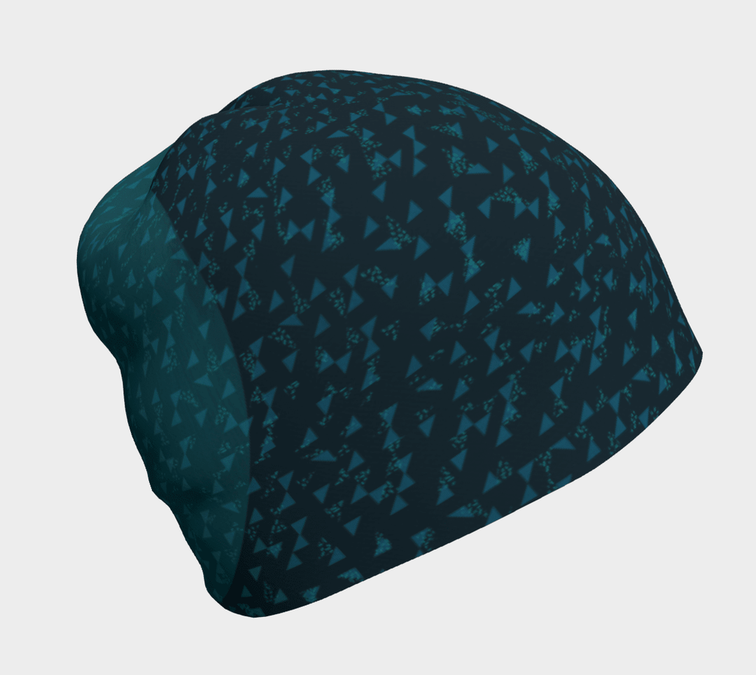 Close-up view of the Teal Flakes Beanie with a dark teal base and scattered light teal triangles.