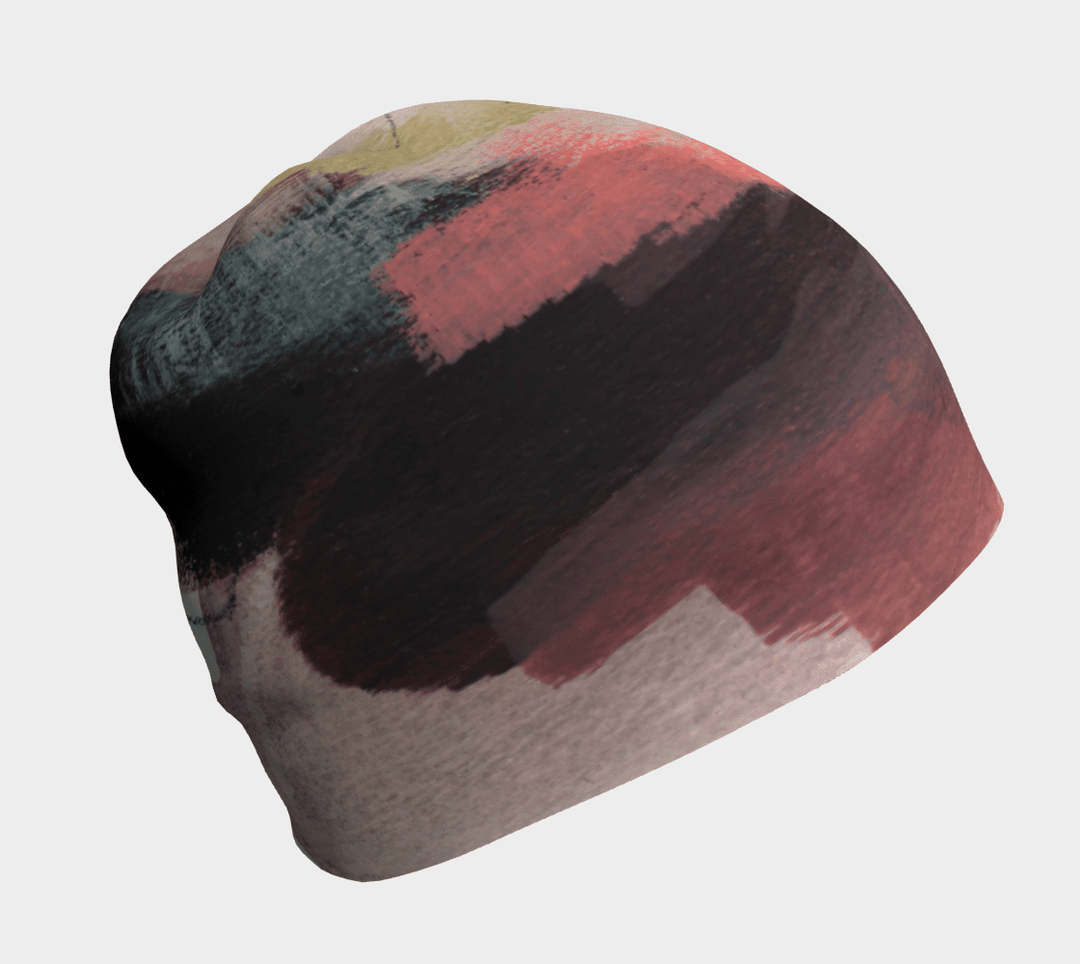 Gros plan de la tuque "Le Nomade Artistique", montrant son design abstrait de coups de pinceau dans des tons doux.