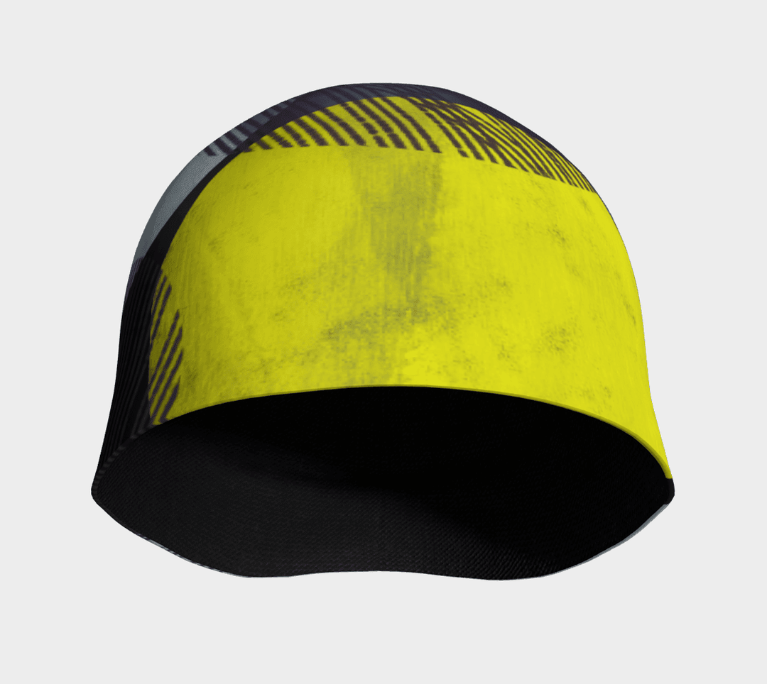 Vue intérieure de la Tuque à Motifs Jaunes, montrant la doublure noire et le motif extérieur jaune et gris.
