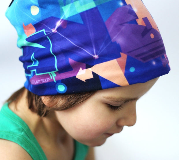 Boy wearing Lalita's Art Shop colourful Galaxy Grow-with-me beanie by Ankhone