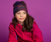 Girl wearing the Lalita's Art Shop City sport beanie designed by Canadian artist Ankhone
