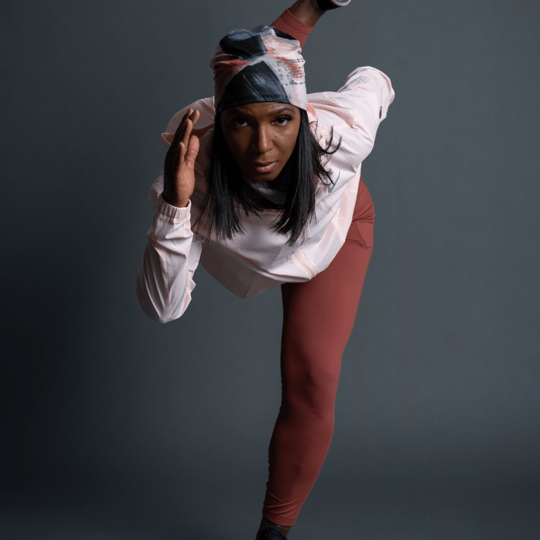 Sportive woman ready to head outside for her run wearing La Vie en Rose beanie and assorted multifunctional tube by Catherine Parent for Lalita's Art Shop.