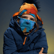 Kid wearing the Blue and Orange Montreal polar tube and assorted beanie from Ankhone for Lalita's Art Shop.