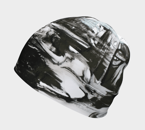 Side picture of the sporty unisex toque with a black and white abstract pattern designed by the talented Catherine Parent. Inspired by nature, this self-taught artist aims to create art accessible to all.