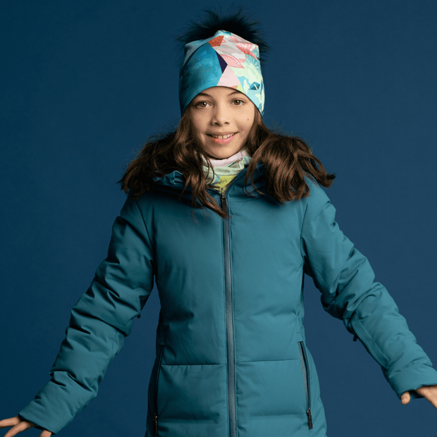 Light, breathable tube paired with a floral and blue beanie with removable navy pom. 