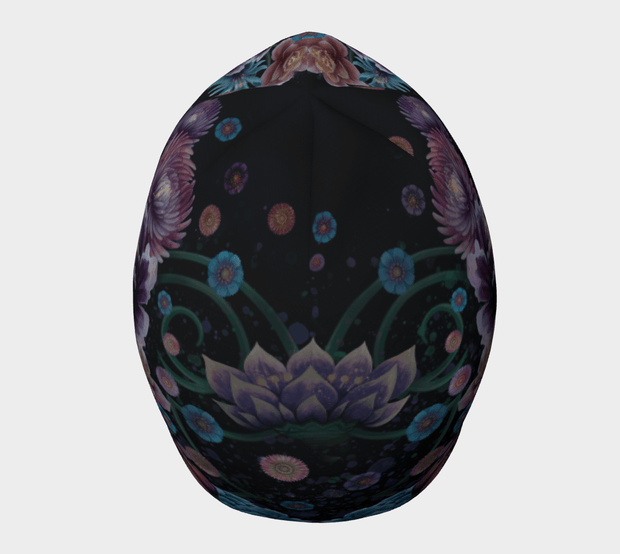 Photo of the top of the Flora beanie designed by artist Claire Anghinolphi. This bamboo beanie is perfect for all sports activities. It is black with pretty floral patterns and goes with all your outfits