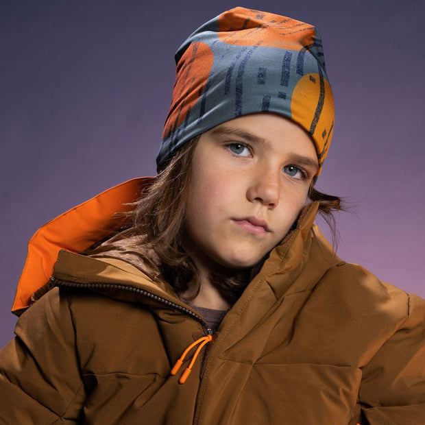 Boy wearing the gray, black, and orange bamboo toque for a great season of alpine skiing.