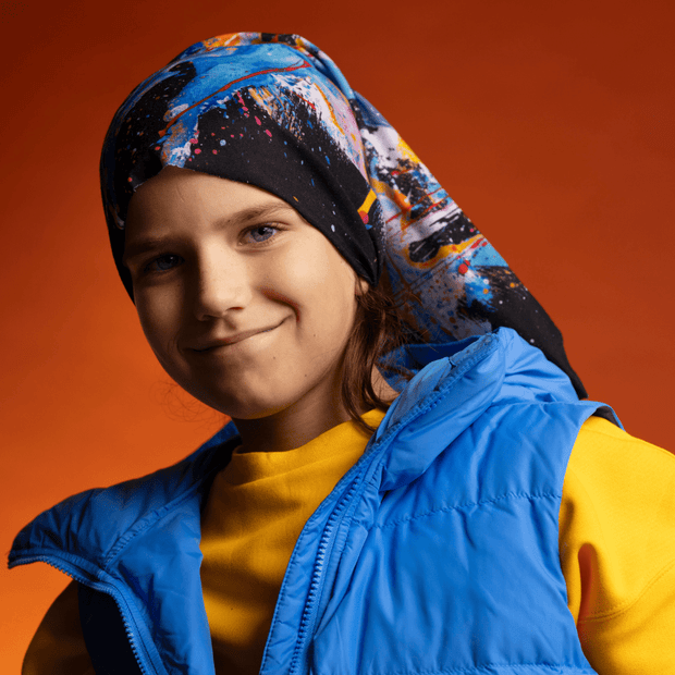 Kid wearing the new Matrix Blue and Black Multifunctional tube as headwear. Design by Megane Fortin for the Lalita's ArtShop 24 Collection.