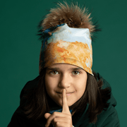 Front view removable pompom bamboo tuque. Girl with a deep green jacket wearing the toque