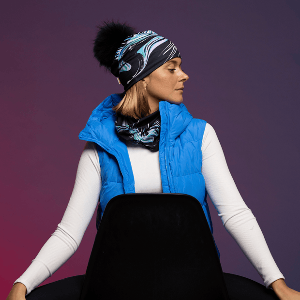 Woman wearing the Black and Blue Heron Polar tube with assorted pompom beanie by Julie Rocheleau for the Lalita's Art Shop 24 collection