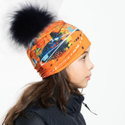 Left side view of the orange abstract with big  blue fur pom. 